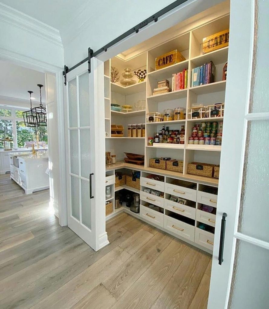 An open, labeled pantry and a fully visible drawer organizer—accessible storage done right.