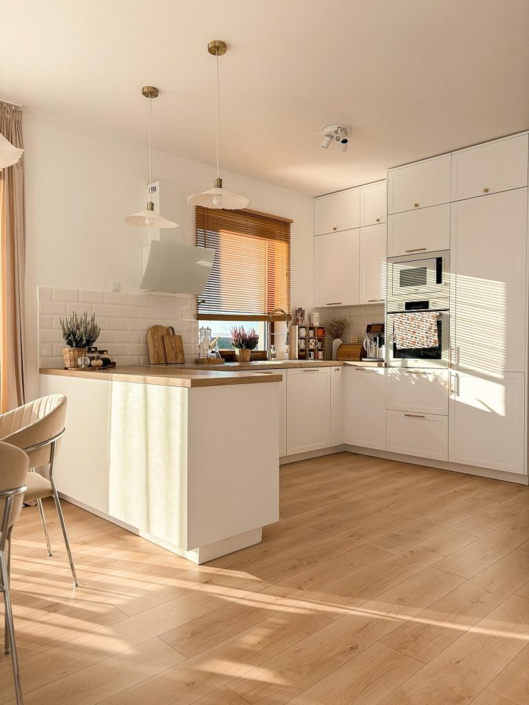 Full-height shaker cabinetry replaces open shelving without losing warmth.