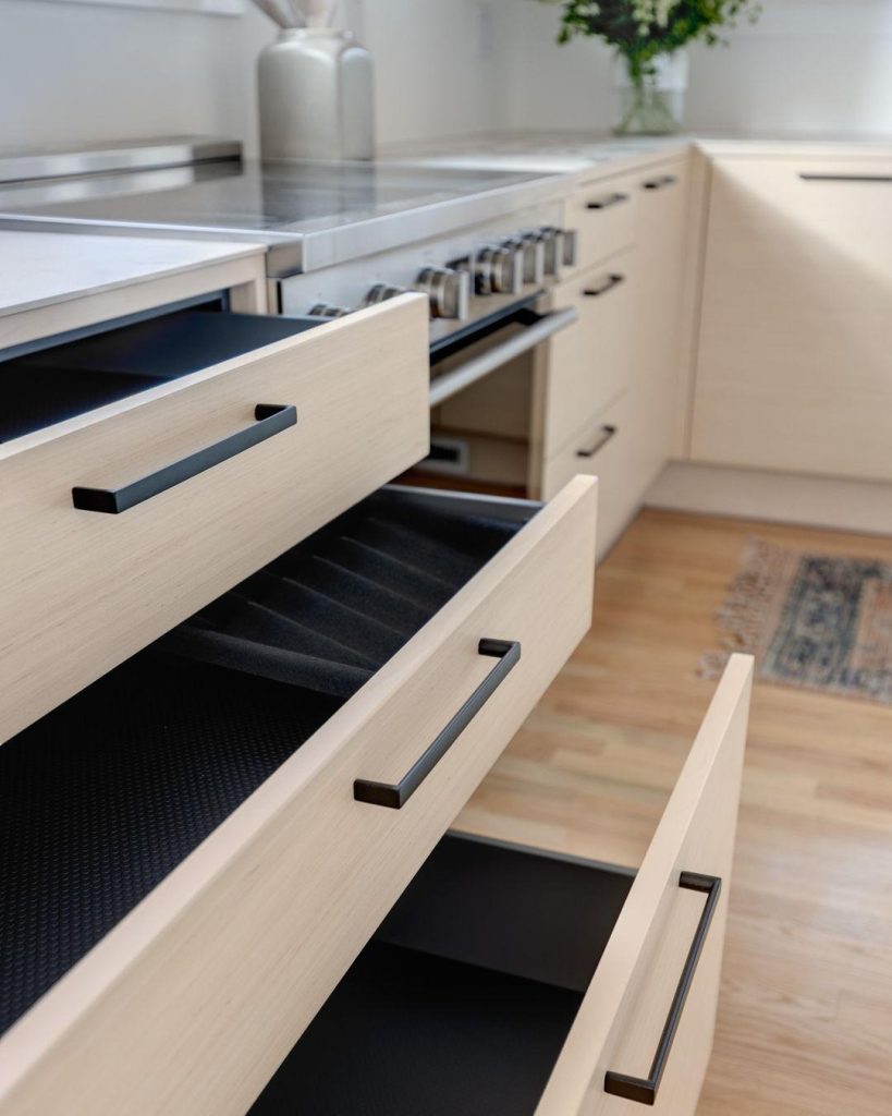 An open, labeled pantry and a fully visible drawer organizer—accessible storage done right.